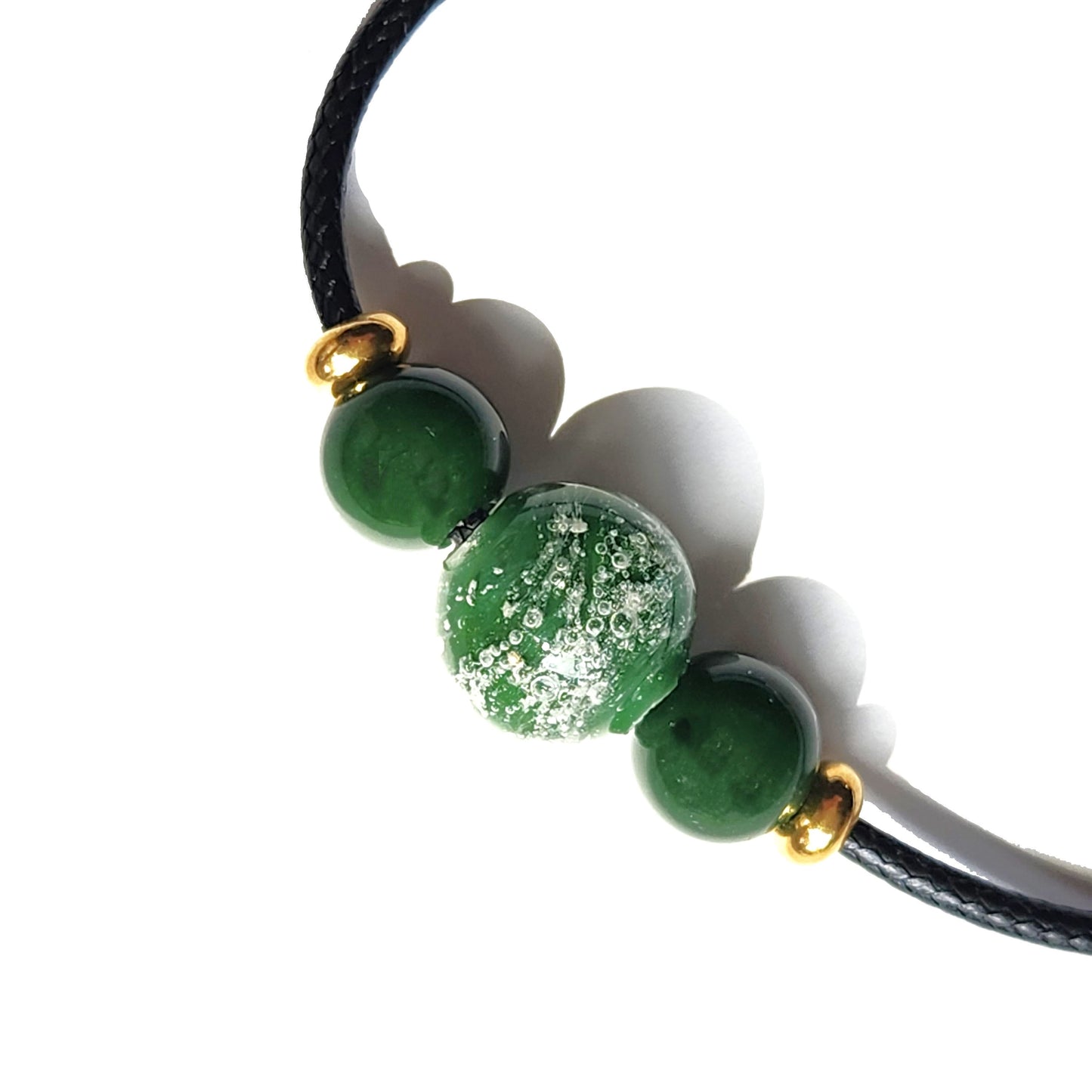 Green Forever Close Ashes Necklace with ash-infused center bead and gold accents. Handmade cremation jewelry on black cord.