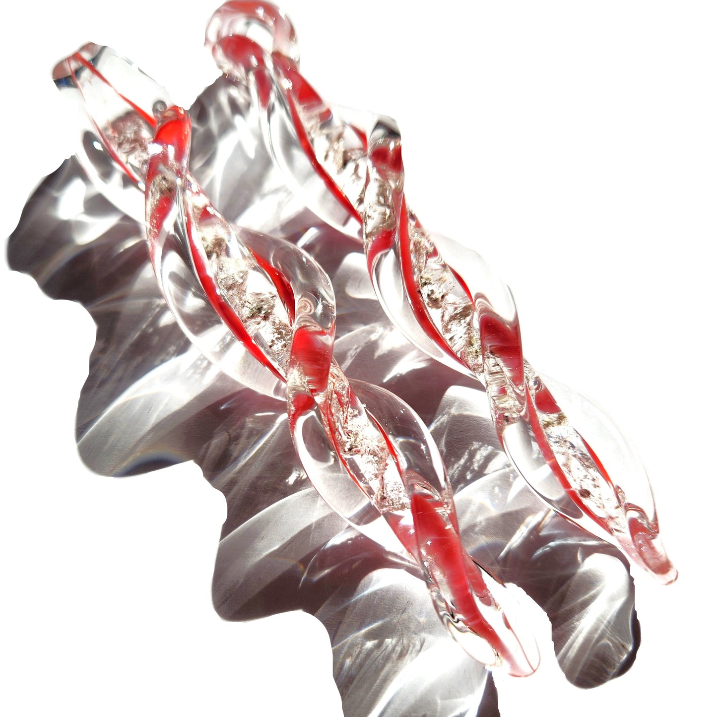 Frozen in Time Cremation Keepsake Suncatcher in red and clear glass with ashes infused, twisted icicle design for memorial ornament display.