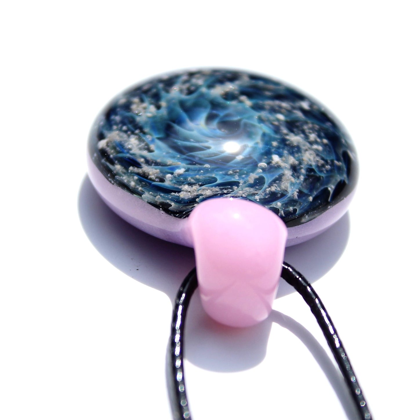 Galaxy Cremation Pendant – Handmade Ashes Memorial Necklace featuring a swirling blue and black glass design with embedded ashes and a pink glass bail.