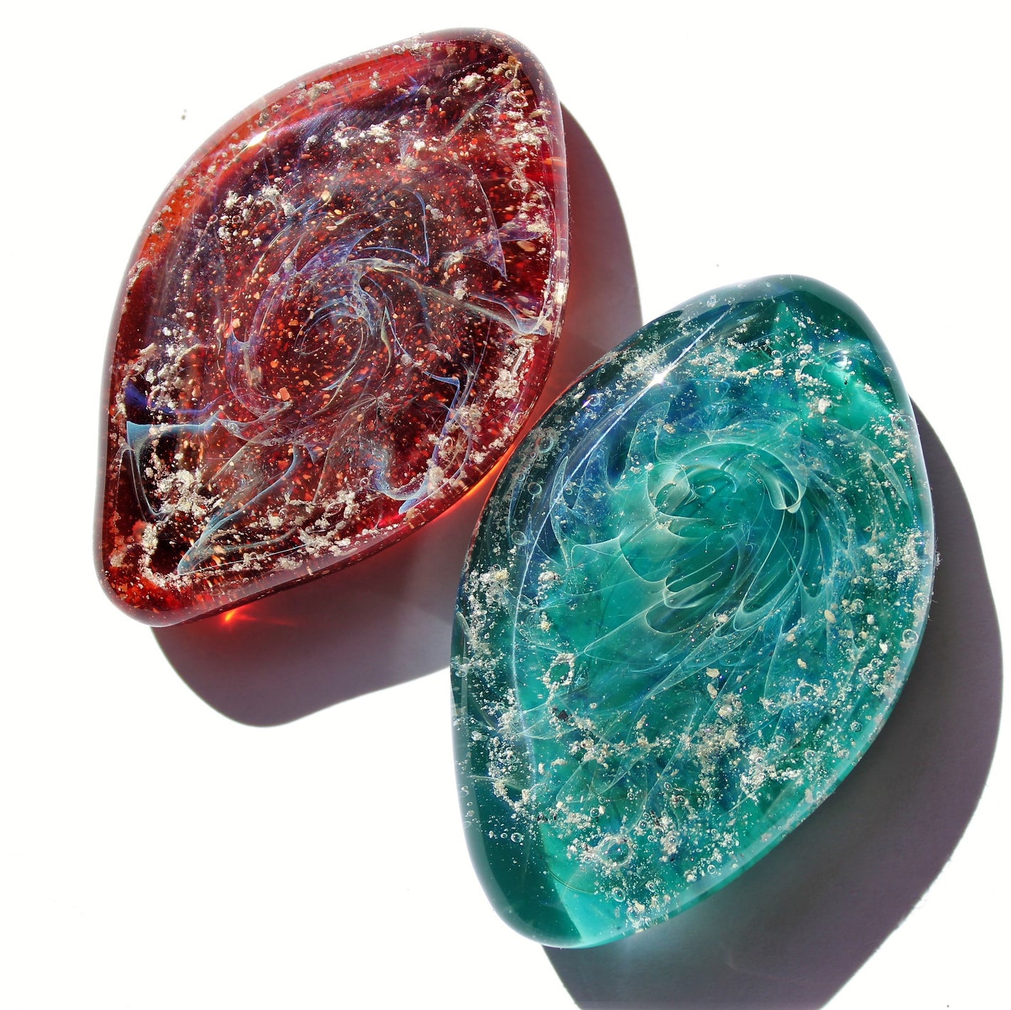 Glass cremation touchstones with infused ashes in Red Brick and Turquoise colors made by DragonFire Glass