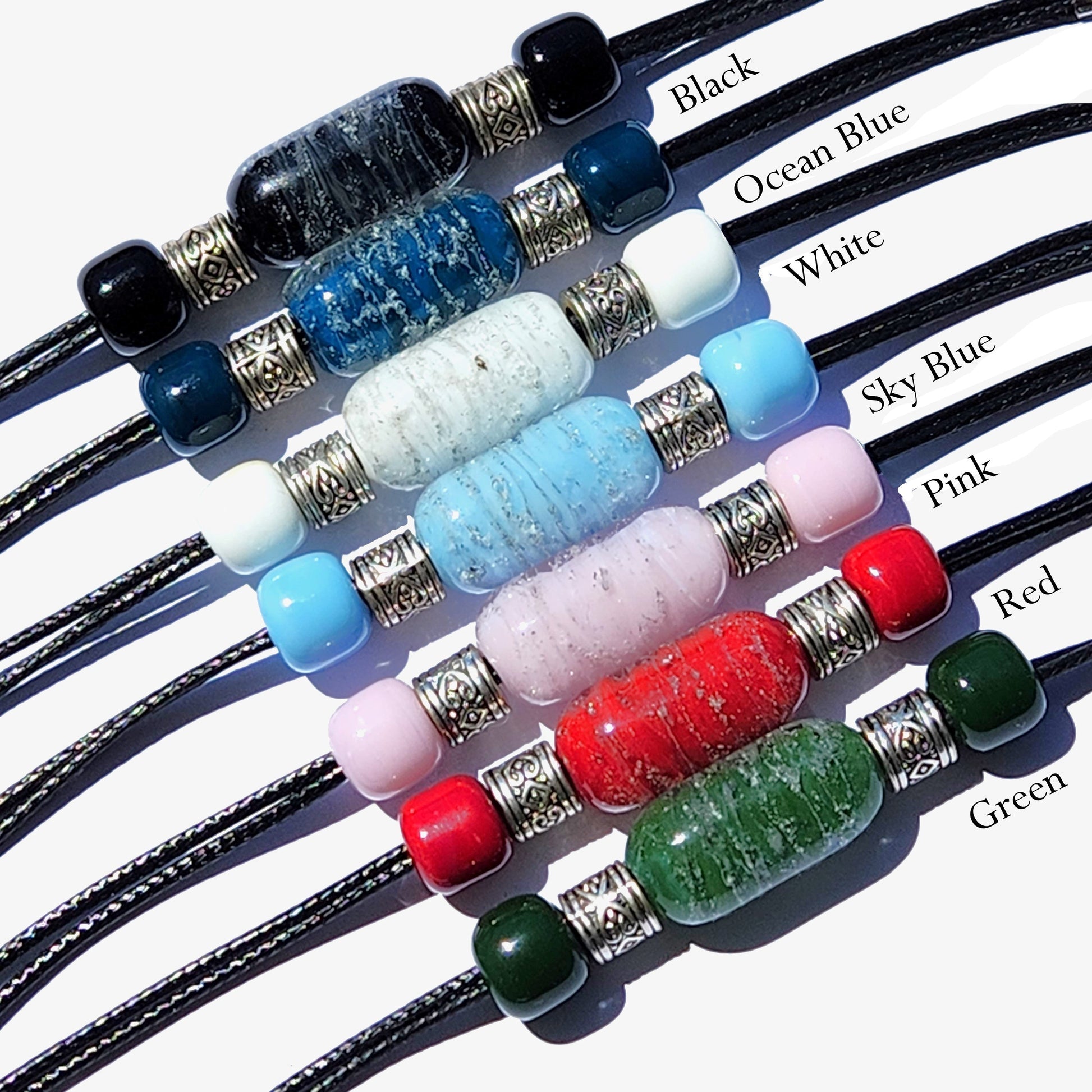 Bracelet with Ashes | Remember Me Urn Bracelet in black, blue, white, pink, red, and green cremation beads with stainless steel accents.
