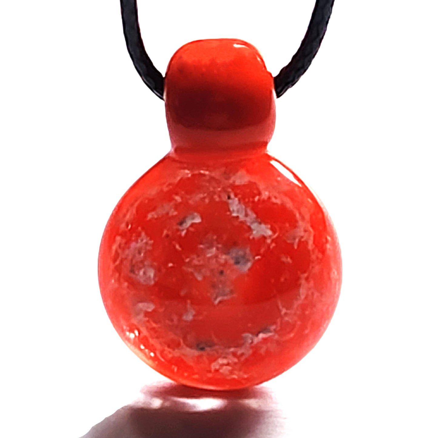 Starred Night - Cremation Pendant Necklace in vibrant red borosilicate glass with embedded ashes on black cord.