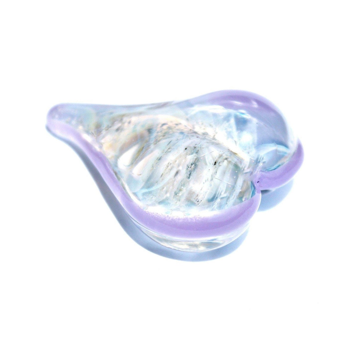 Lavender-trimmed heart-shaped cremation touchstone with ashes, a personalized memorial urn alternative for remembrance rituals.