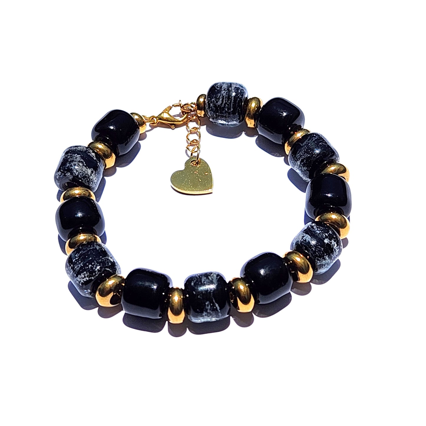 Black Memorial Bracelet featuring handmade ash-infused glass beads with gold accents and heart charm, a unique cremation urn bracelet.