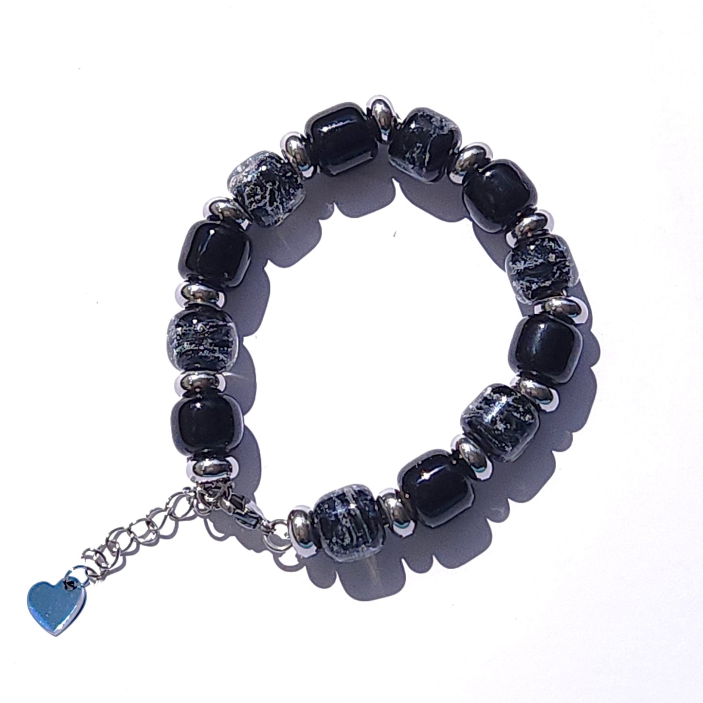 Black Memorial Bracelet for Men featuring handmade ash-infused glass beads and stainless steel spacers. A unique cremation bracelet tribute gift.