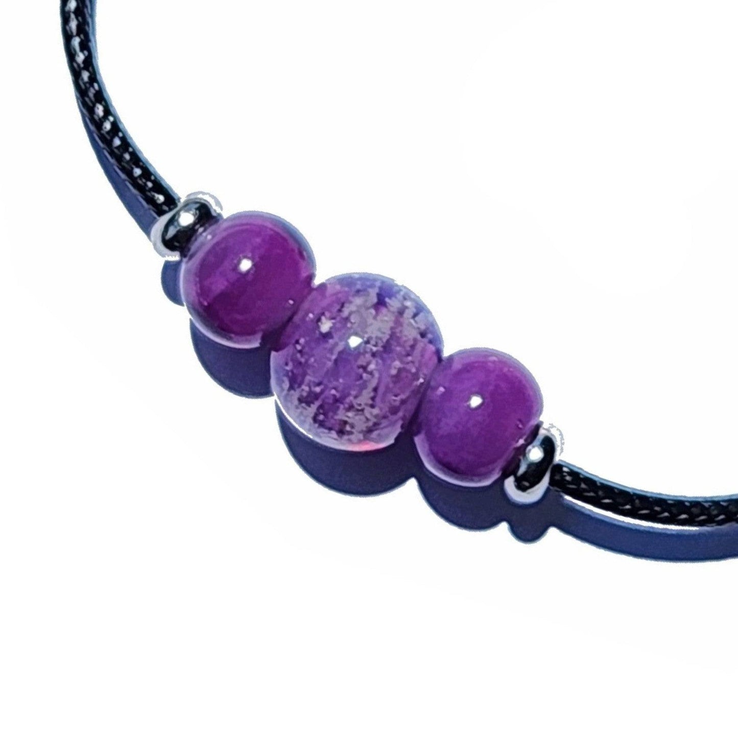 Purple Forever Close Ashes Necklace with ash-infused center bead and silver accents. Cremation jewelry on black cord.
