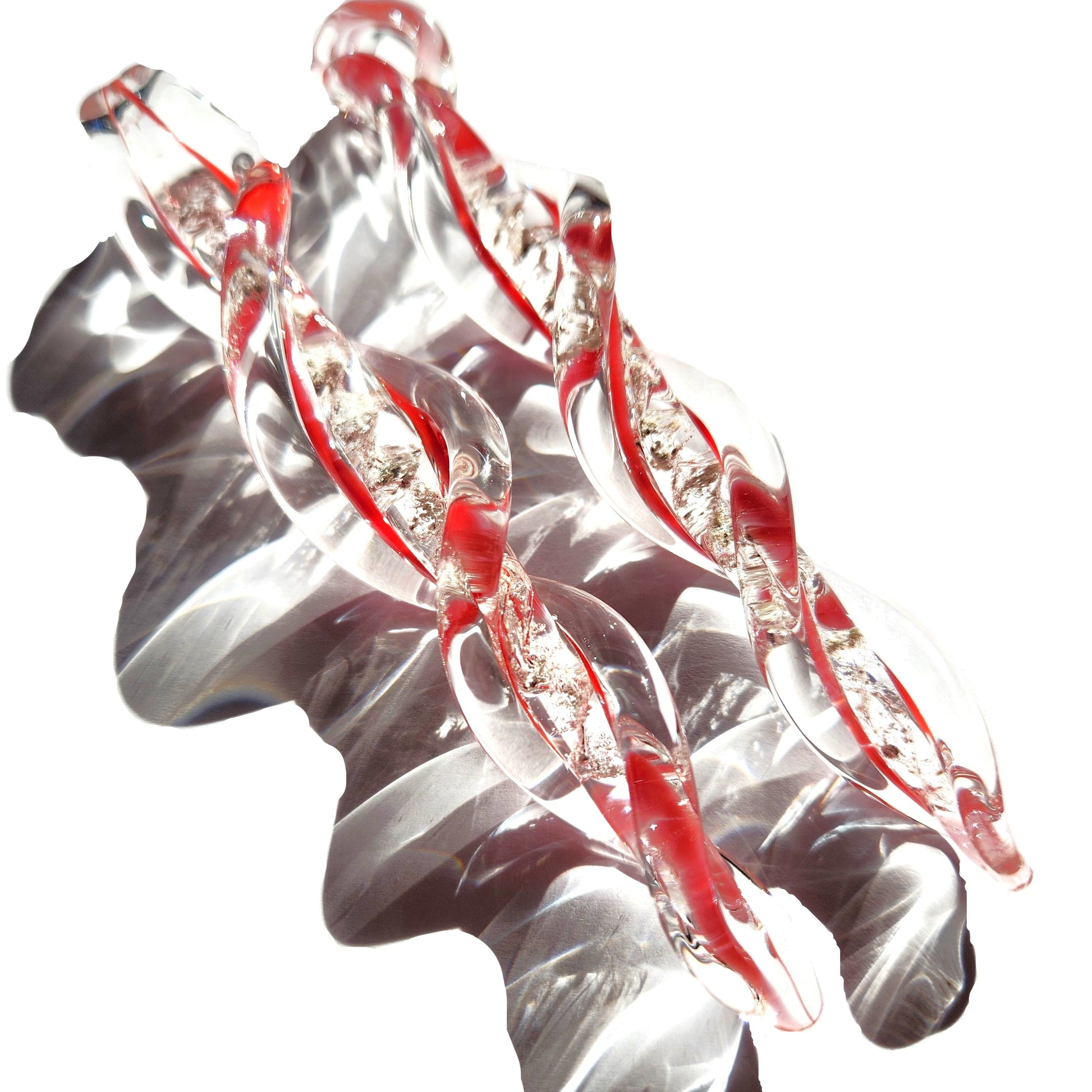 Frozen in Time Cremation Keepsake Suncatcher in red and clear glass with ashes infused, twisted icicle design for memorial ornament display.
