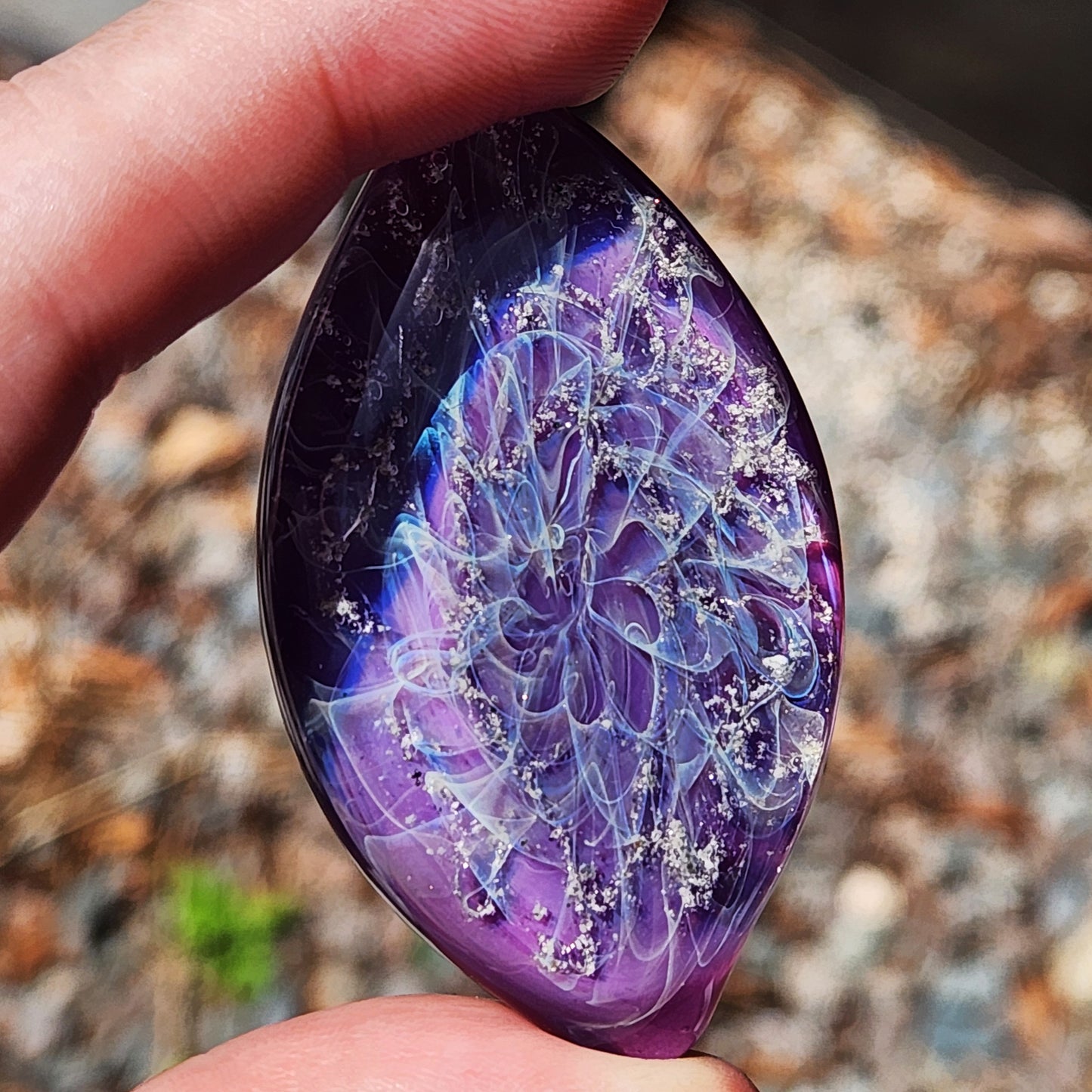 Galaxy Cremation Touchstone | Memorial Glass Keepsake with Ashes in deep purple and blue hues, featuring a swirling galaxy design with white ash inclusions.