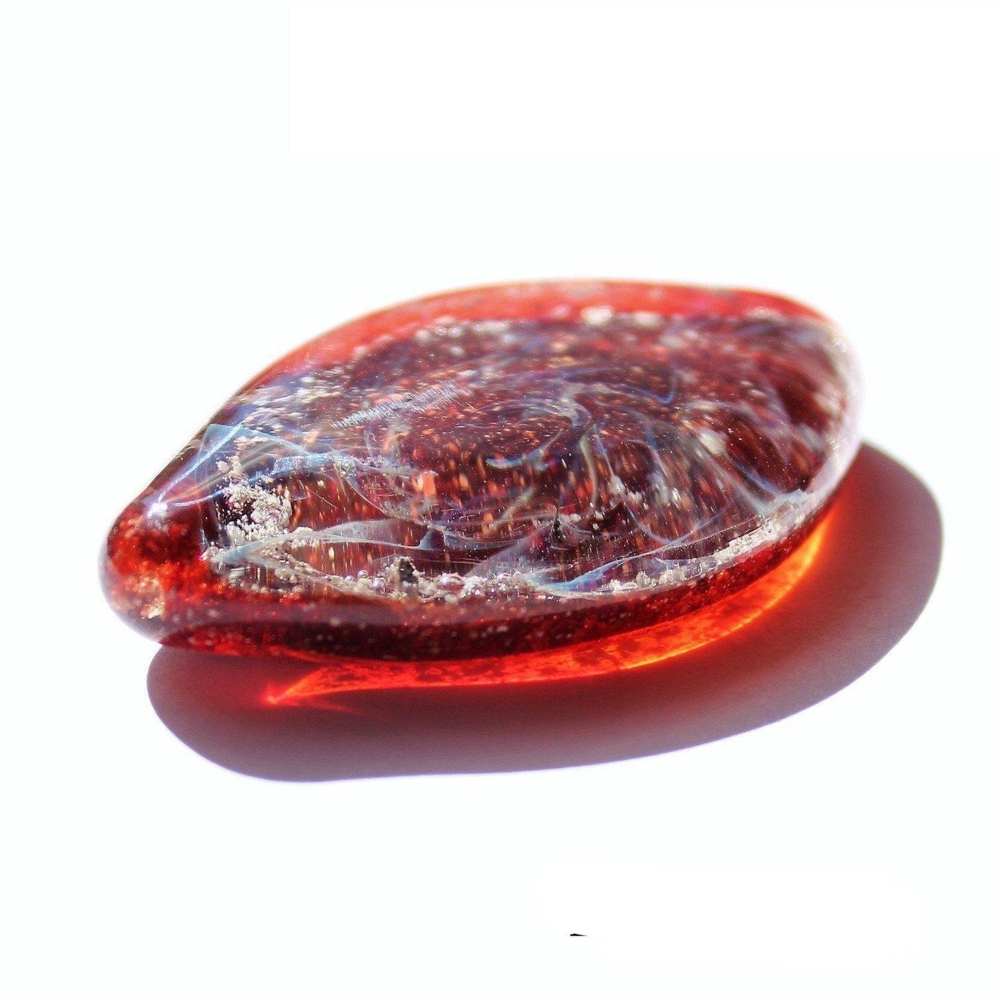 Galaxy Cremation Touchstone in red with swirling galaxy design, a handmade memorial glass keepsake infused with ashes for remembrance ceremonies.