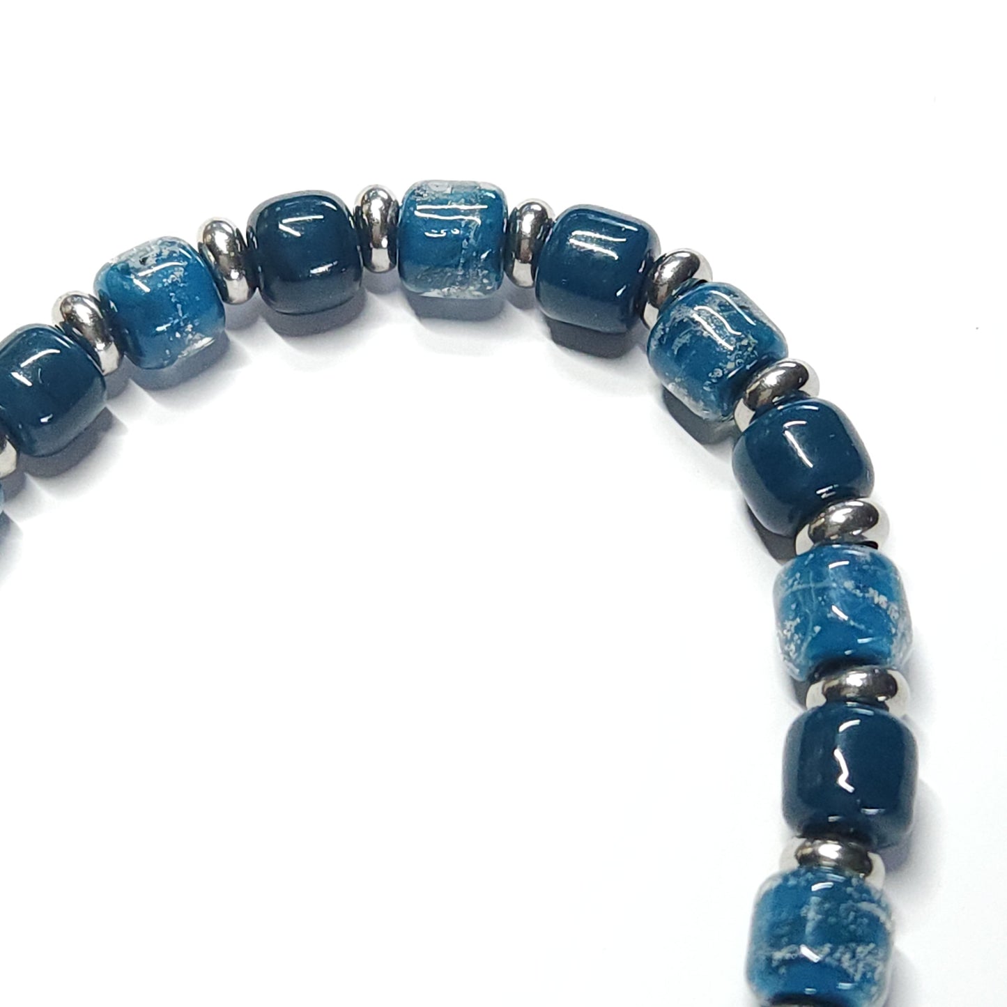 Ocean Blue Memorial Bracelet featuring ash-infused glass cremation beads and stainless steel spacers. Handmade tribute jewelry for memorial ceremonies.