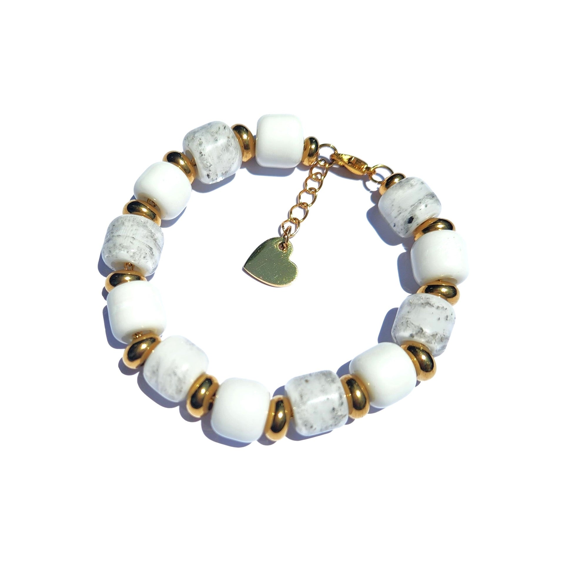 White Cremation Bracelet from the Eternal Collection featuring ash-infused white and gray beads with gold accents and a heart charm clasp.
