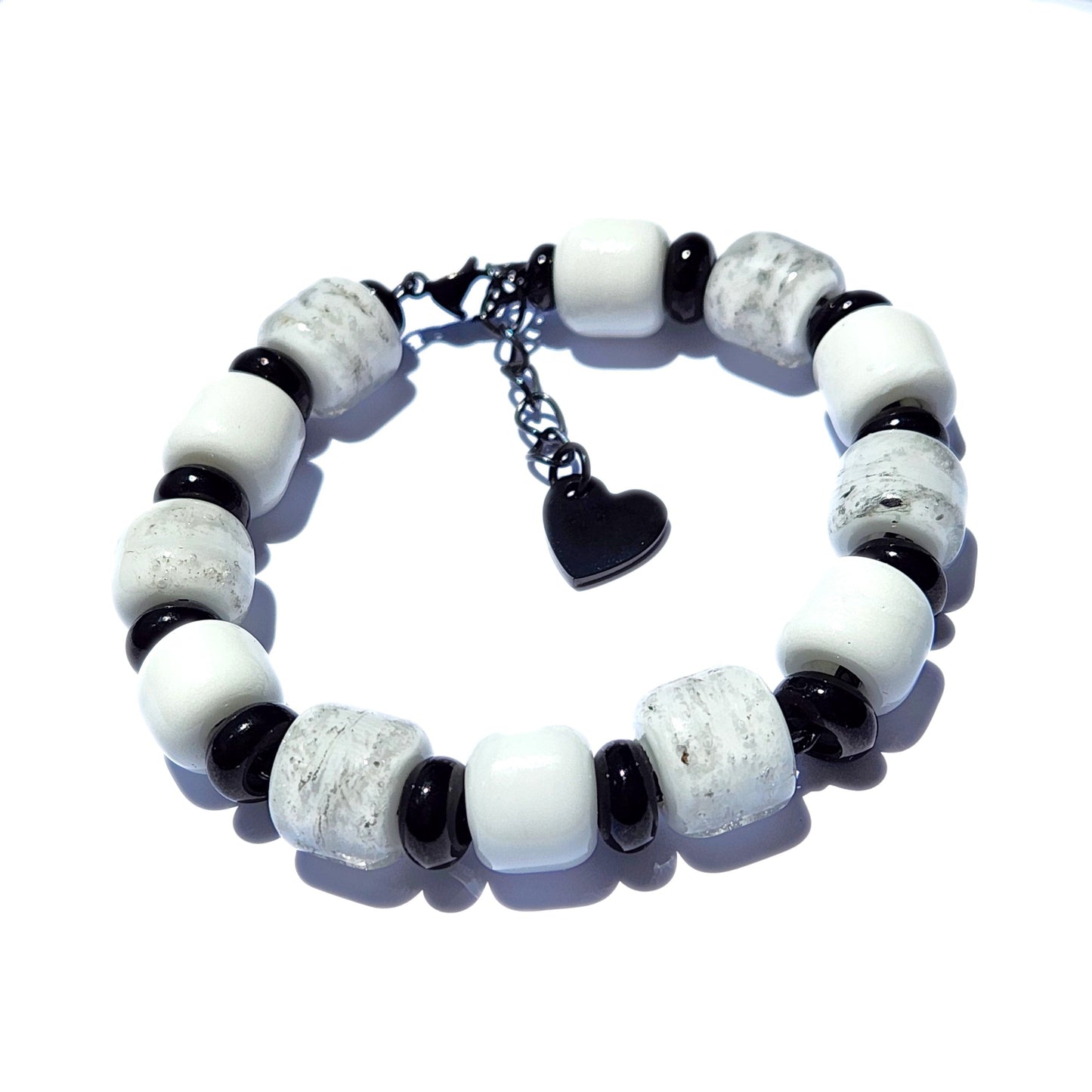 White Cremation Bracelet from the Eternal Collection featuring ash-infused white and black beads with a heart charm. Memorial jewelry for men and women.
